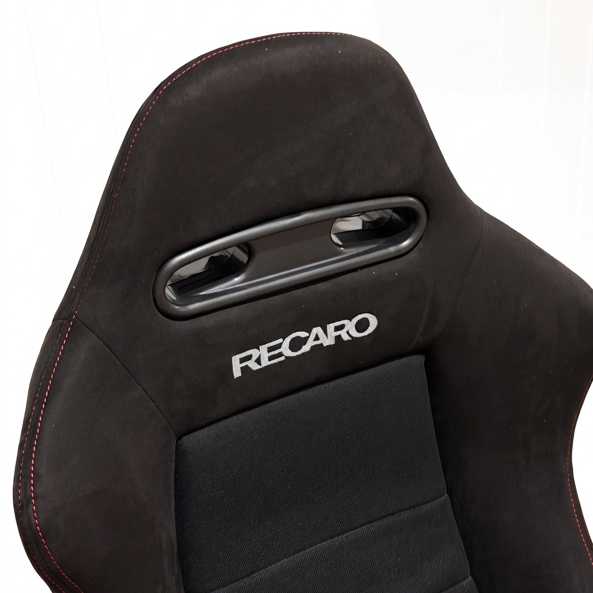 SR4 style bucket seat headrest and harness slots close-up