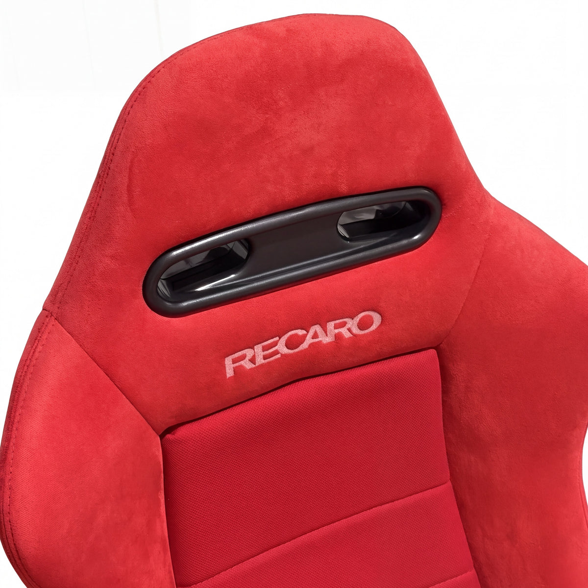SR4 style bucket seat in red, headrest and harness slots close-up